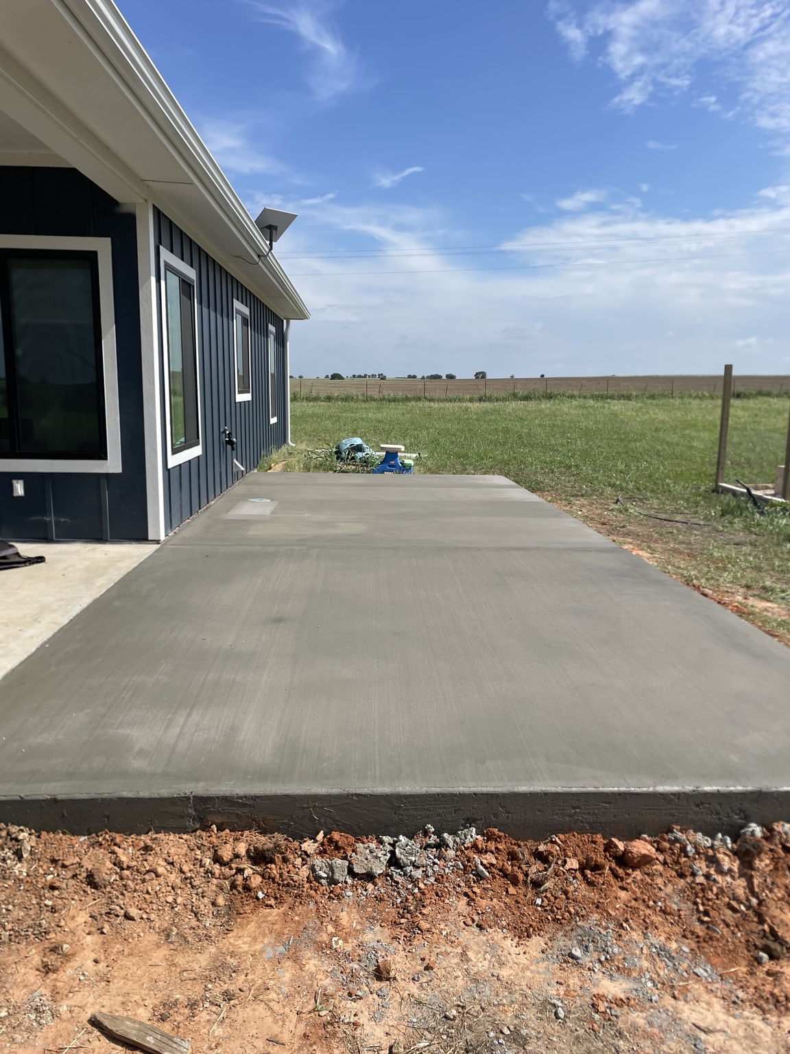 Finished concrete patio beside a home